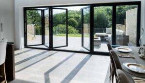 Bi-Folding doors installed on a residential space which open to a patio.
